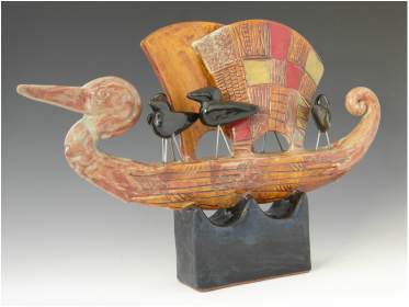 Ceramic sculpture of bird headed sailboat with red highlights by MaryLynn Schumacher