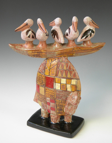 MaryLynn Schumacher sculpture of clay, featuring 5 pelicans in a boat on a turtle.