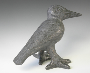 MaryLynn Schumacher clay sculpture of raven, free standing, metallic gray finish with incised hand drawn patterns.